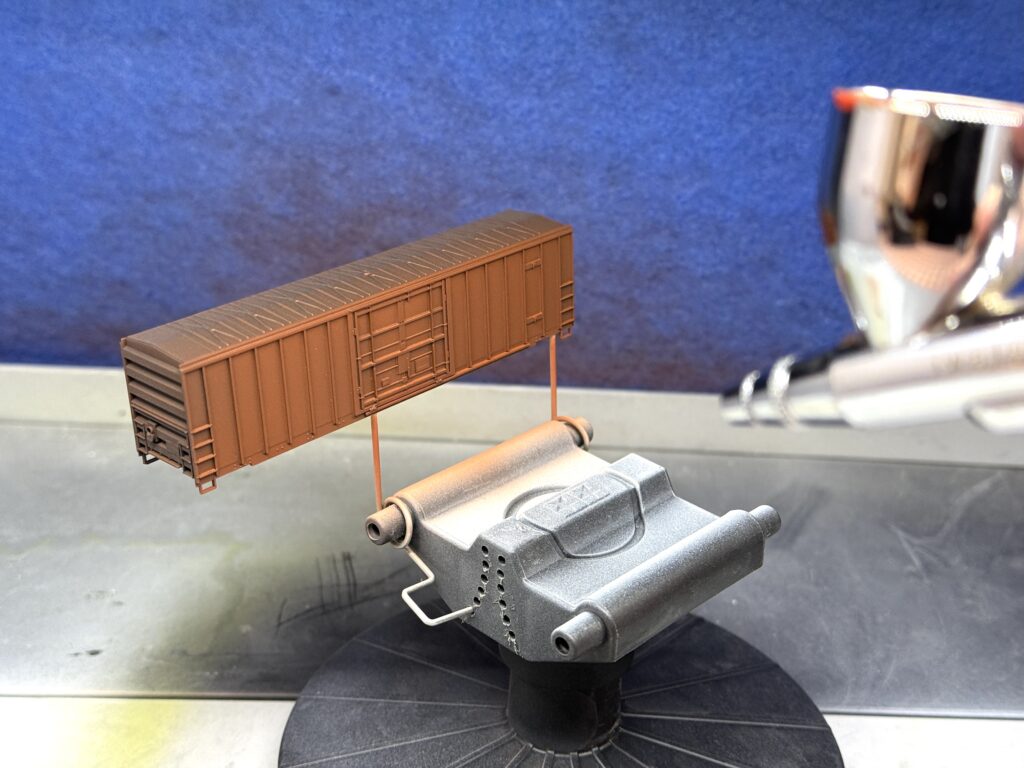 Painting an N scale undecorated boxcar with Vallejo colors