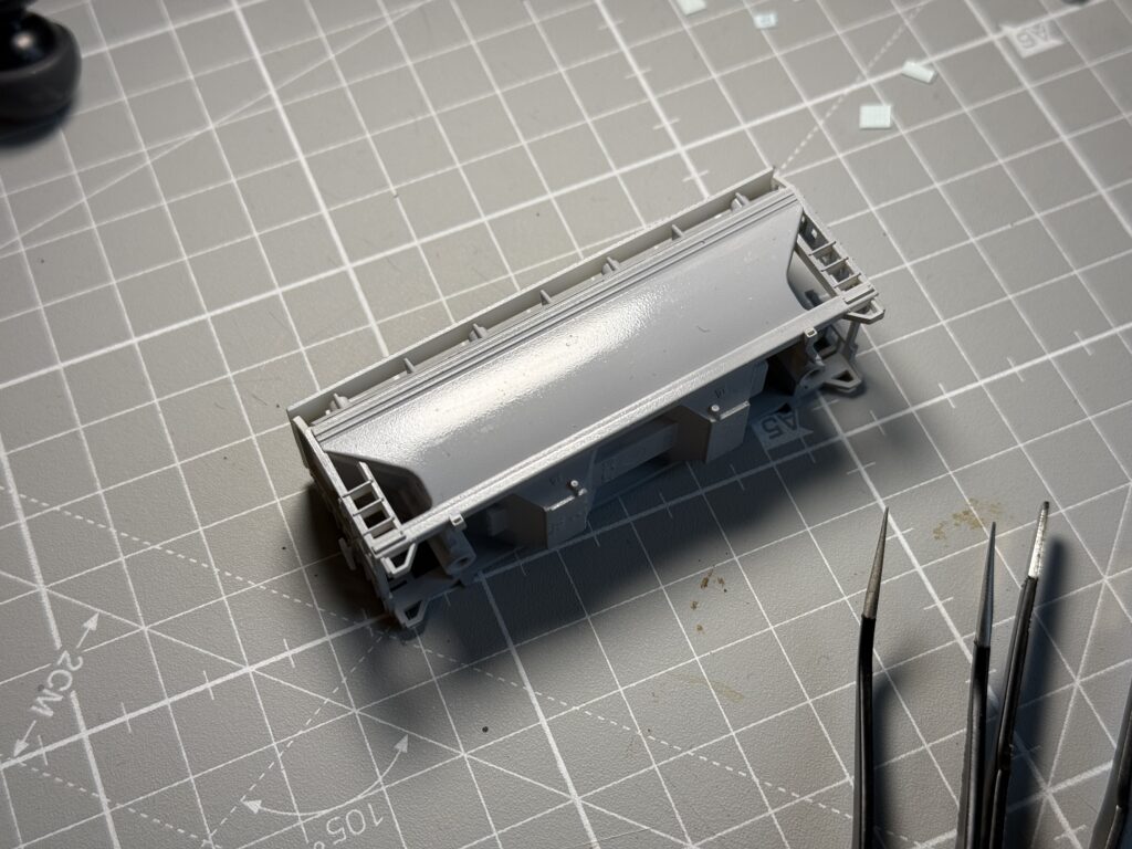 ACF 2-bay covered hopper painted gloss clear.