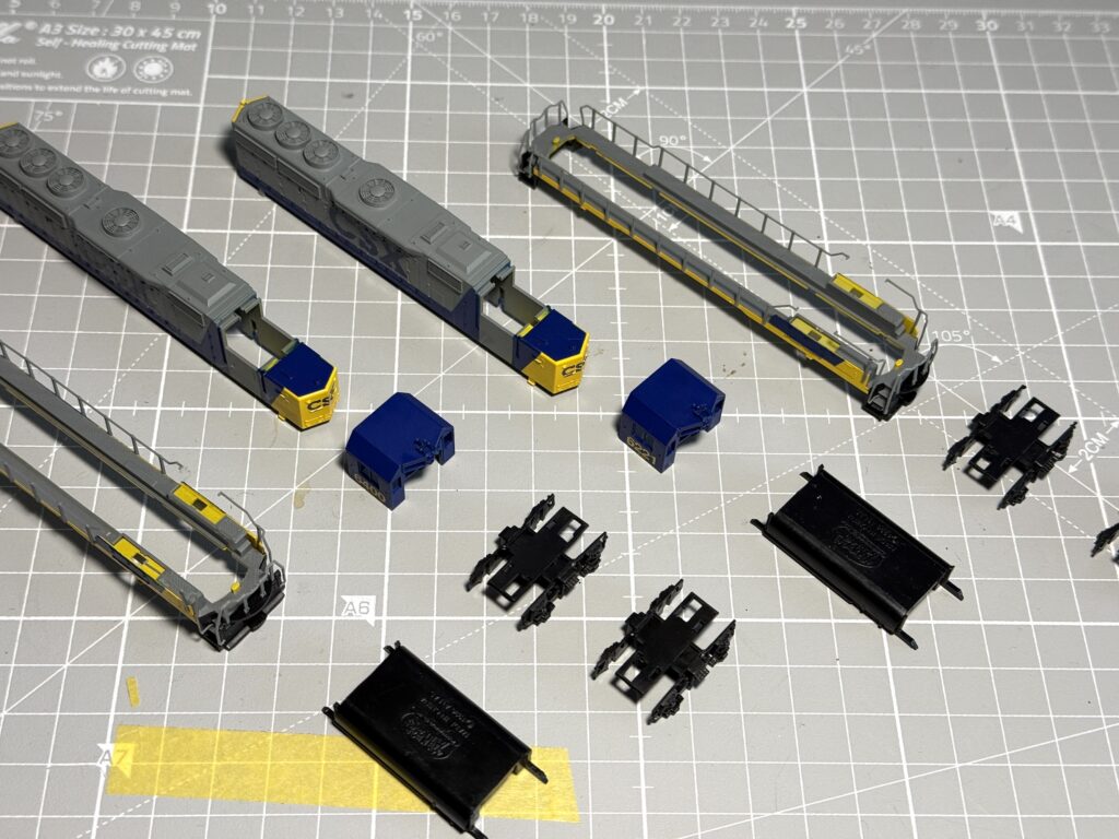 Painting a locomotive - All the disassembled shell parts are now ready for paint stripping before the repainting process begins.
