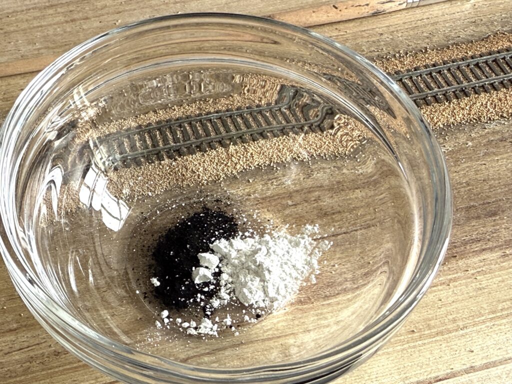 Black powdered pigments and plaster of Paris