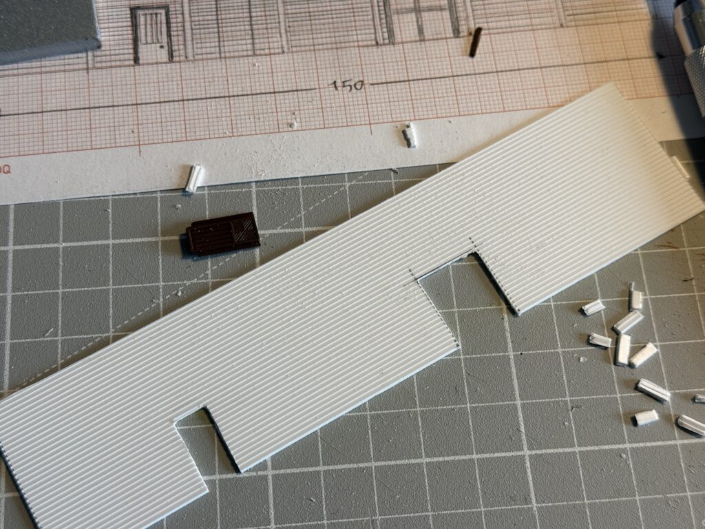 Scratchbuilding a structure needs some filing to refine the door openings