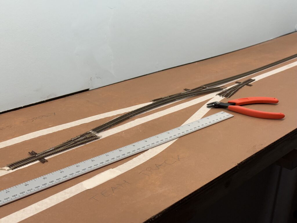 Test-fitting the Atlas code 55 turnouts and Micro-Engineering code 55 flextrack.