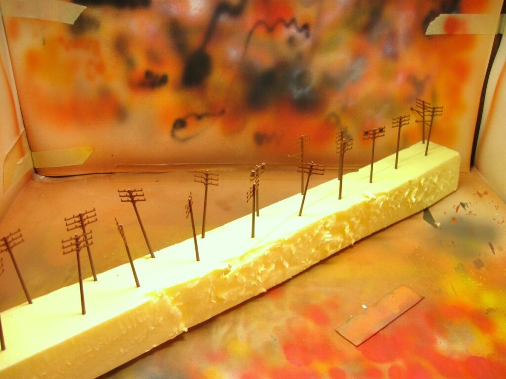 Telephone poles, painted and weathered