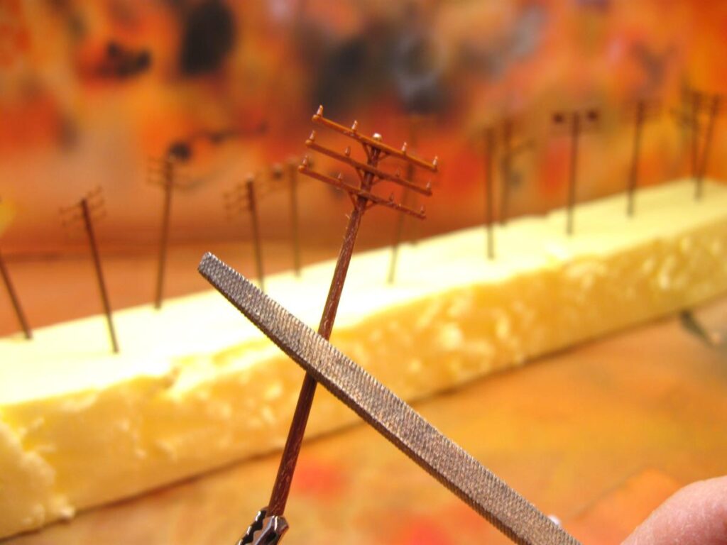 Telephone poles, painted and weathered