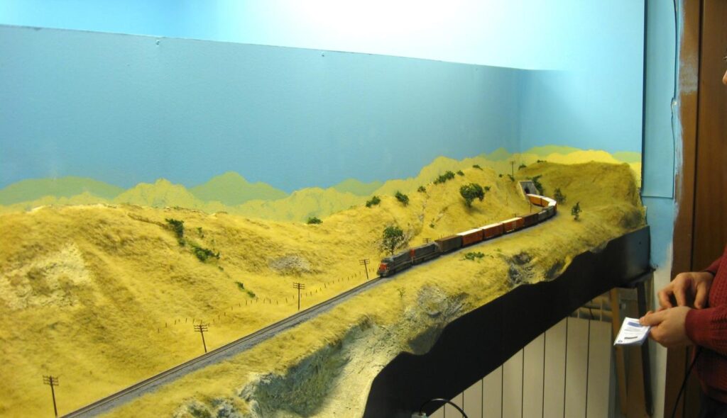 A manifest freight train running on the scenicked portion of the main line.