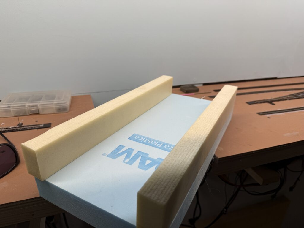 Installing a bridge: riverbed and riverbank made out of foam board.