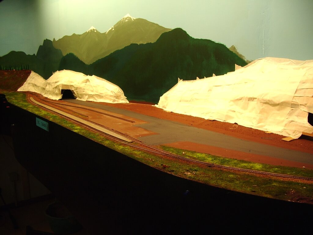 Mountains under construction in the background of St. Jakob's station