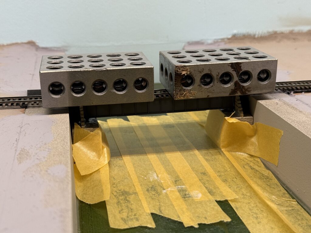 Installing a bridge: keeping the bridge in place with metal weights