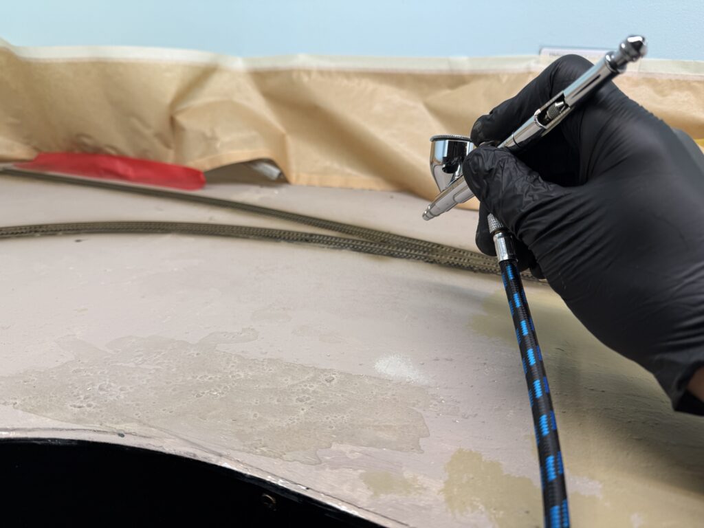 Paint the track with an airbrush